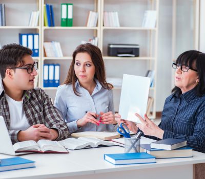 Young student and teacher during tutoring lesson